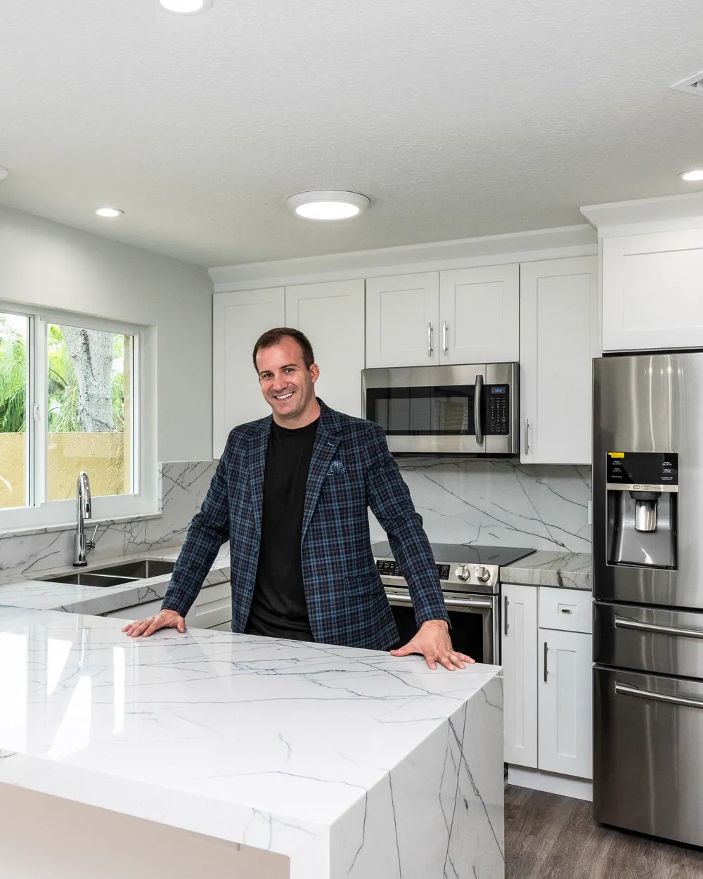 James J. Cloud, founder of Cloud Design Build, standing in a completed Cloud Design Build kitchen