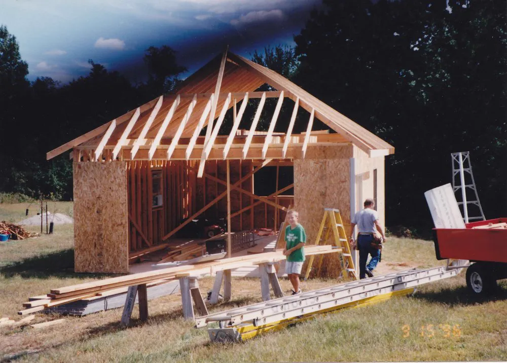 James Cloud as a boy with his father on a framing job, 1996