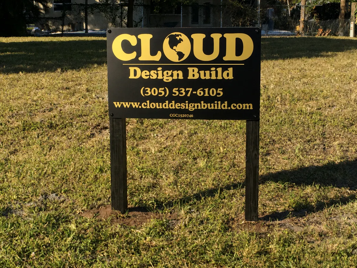 Cloud Design Build jobsite sign on a cleared lot in Boca Raton, Florida