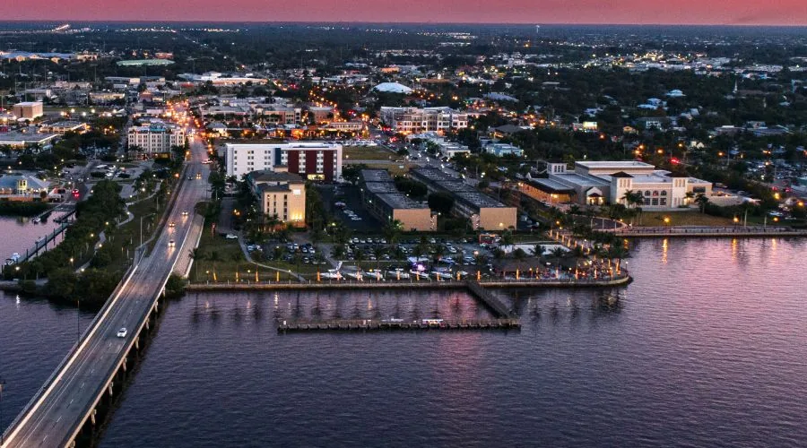 Downtown Punta Gorda at dusk, looking across Charlotte Harbor to the harborwalk, fishing pier and the US-41 bridge