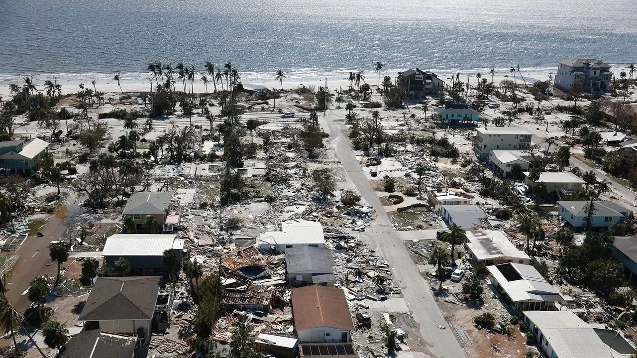 Aerial view of a beachfront neighborhood flattened by Hurricane Ian