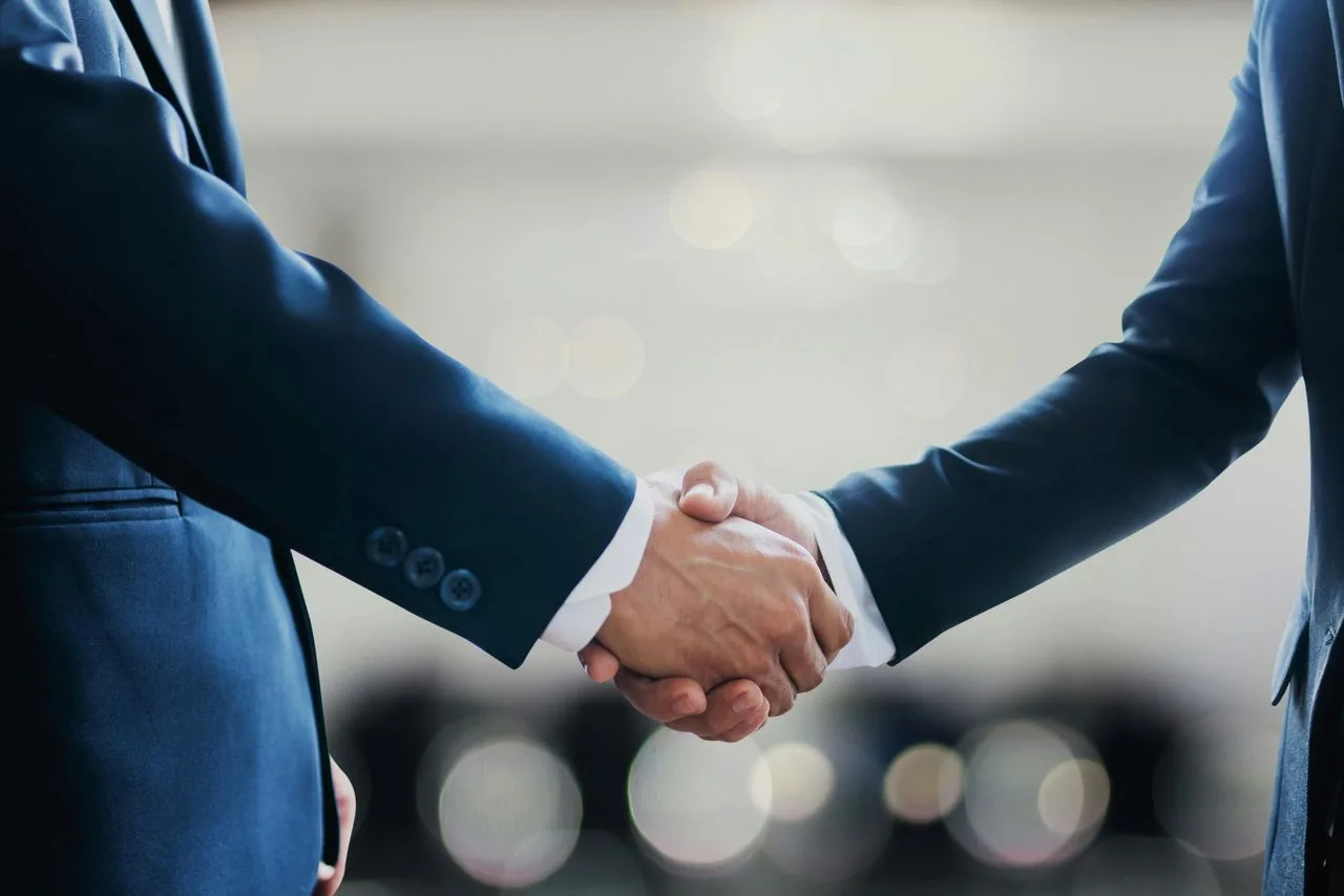Close-up of two businessmen shaking hands